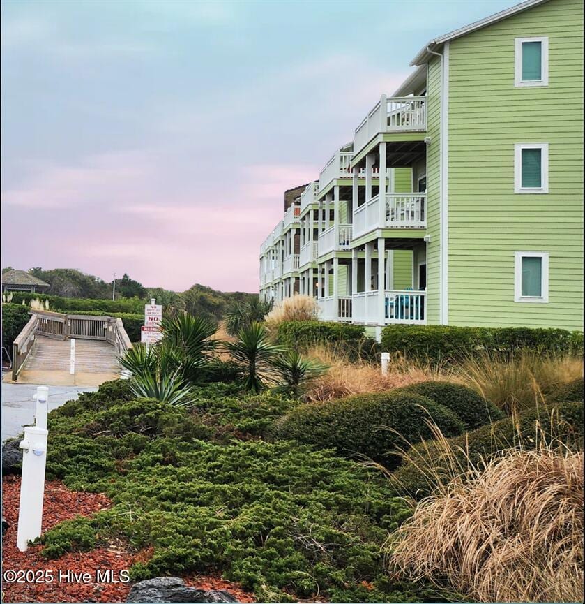 view of outdoor building at dusk