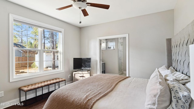 bedroom with ceiling fan and multiple windows