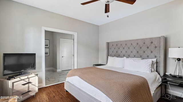 bedroom featuring dark wood-type flooring and ceiling fan