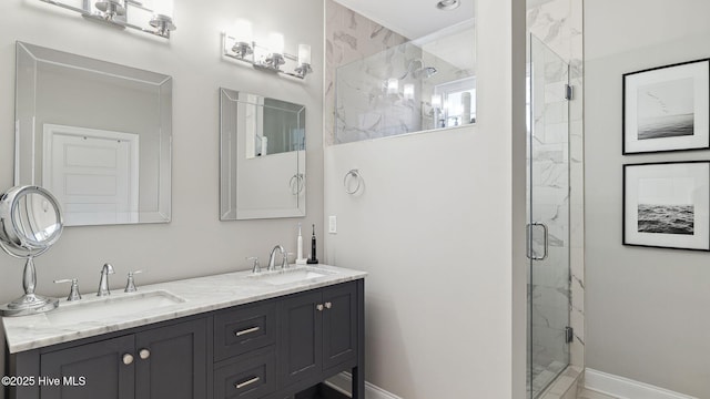 bathroom with vanity and a shower with shower door