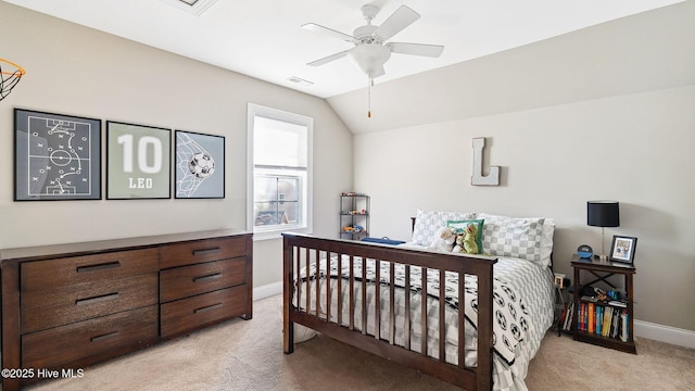 bedroom featuring ceiling fan, light colored carpet, and vaulted ceiling