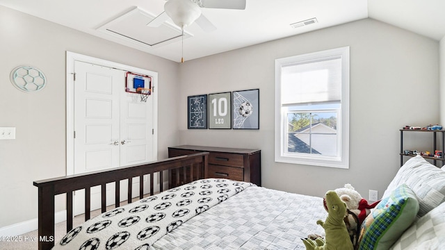 bedroom with lofted ceiling, a closet, and ceiling fan