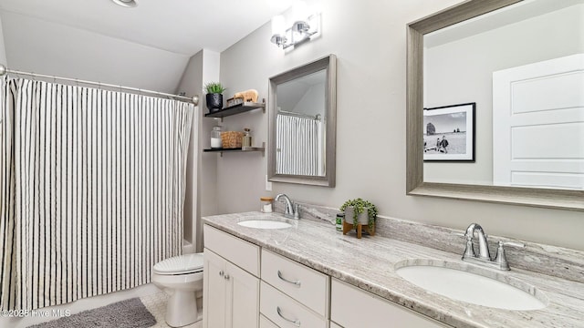 full bathroom with tile patterned flooring, vanity, shower / bath combo with shower curtain, and toilet