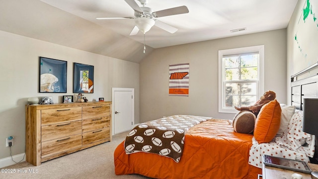 carpeted bedroom featuring lofted ceiling and ceiling fan