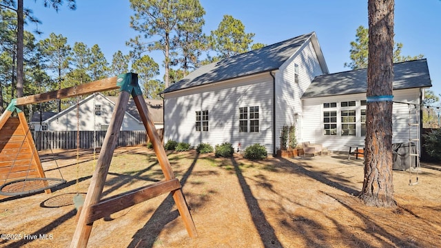 rear view of house featuring a patio