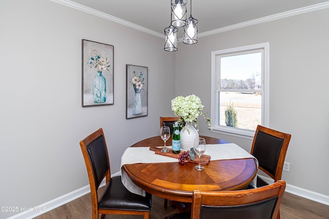 dining space with crown molding and dark wood-type flooring