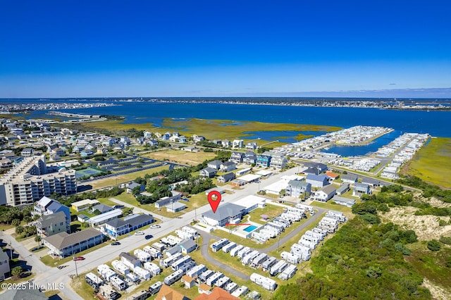 birds eye view of property featuring a water view