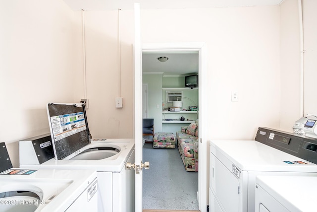 washroom featuring ornamental molding and independent washer and dryer