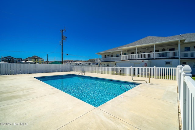 view of swimming pool featuring a patio area