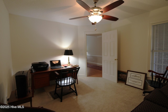 office with ceiling fan and light colored carpet