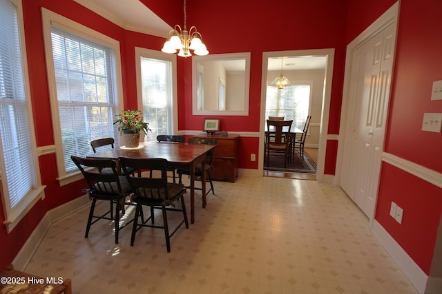 dining room featuring an inviting chandelier and crown molding