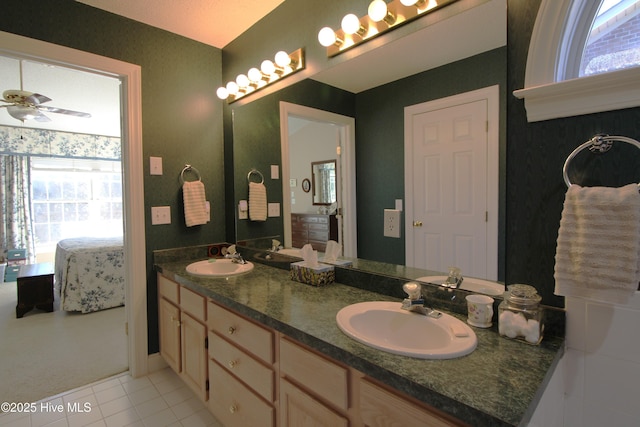 bathroom featuring ceiling fan, tile patterned floors, and vanity