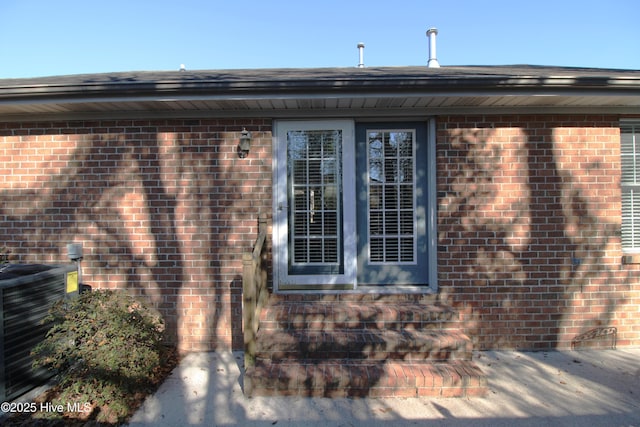 property entrance featuring central AC