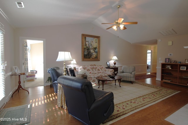 living room with ornamental molding, ceiling fan, light hardwood / wood-style flooring, and lofted ceiling