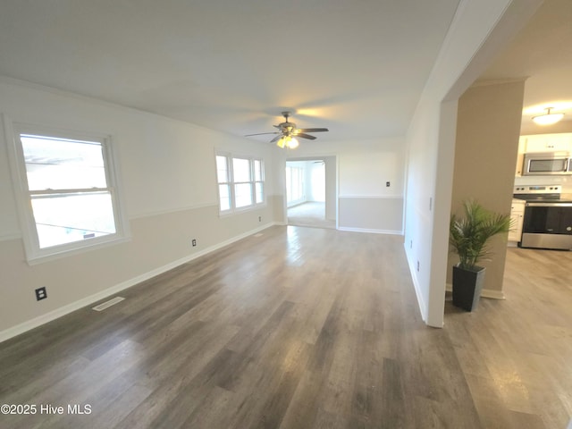 unfurnished living room featuring ornamental molding, ceiling fan, and hardwood / wood-style floors