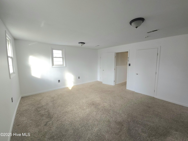 empty room featuring carpet floors