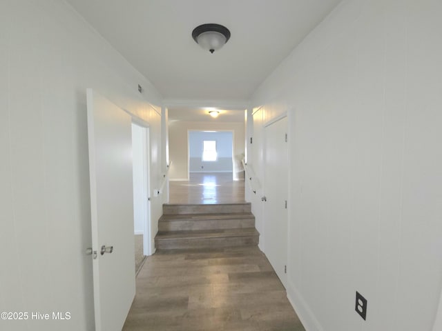 hallway with wood-type flooring