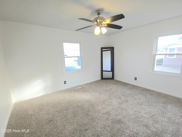 unfurnished room featuring carpet flooring and ceiling fan