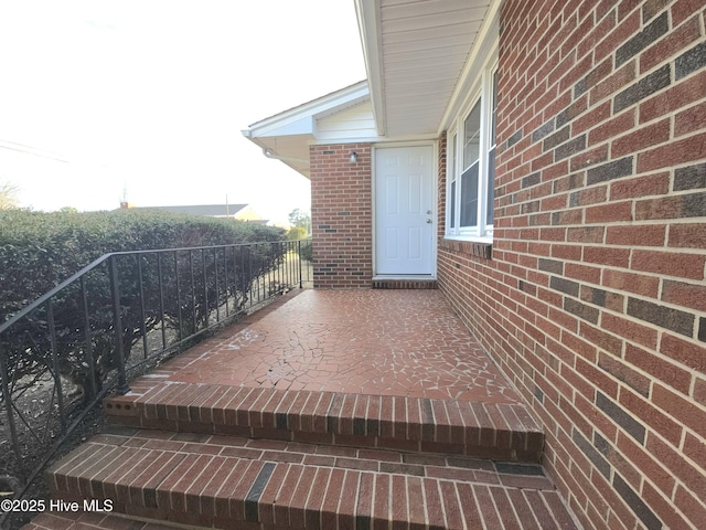 property entrance with a patio