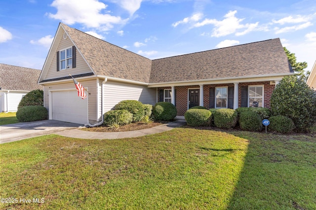 view of front of home featuring a garage and a front lawn