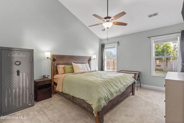 carpeted bedroom featuring ceiling fan and high vaulted ceiling