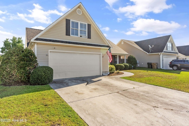 front of property with a garage and a front lawn