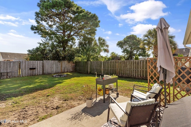 view of patio / terrace featuring an outdoor fire pit