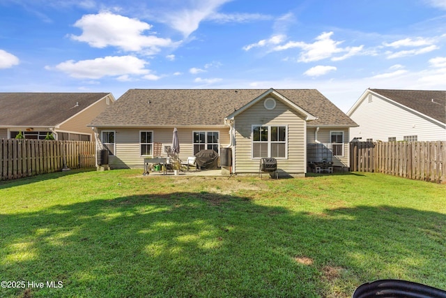 back of property featuring a patio area and a lawn