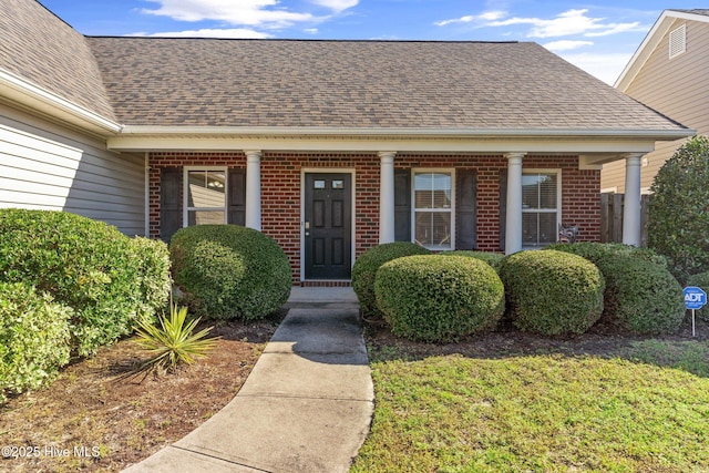 doorway to property featuring a yard