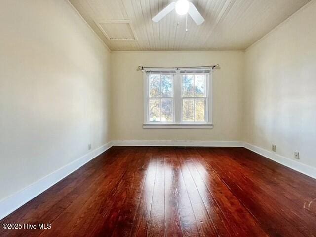 spare room featuring ceiling fan and dark hardwood / wood-style floors