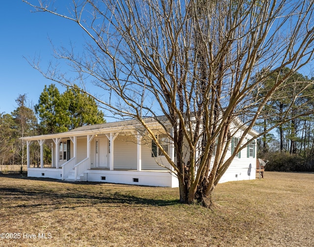 view of front of property with covered porch and a front yard