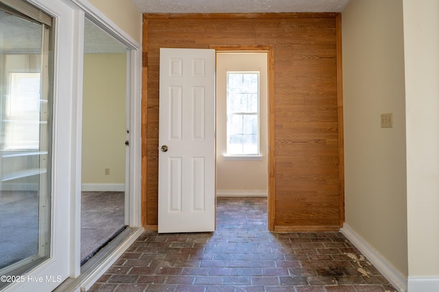 hallway with wooden walls