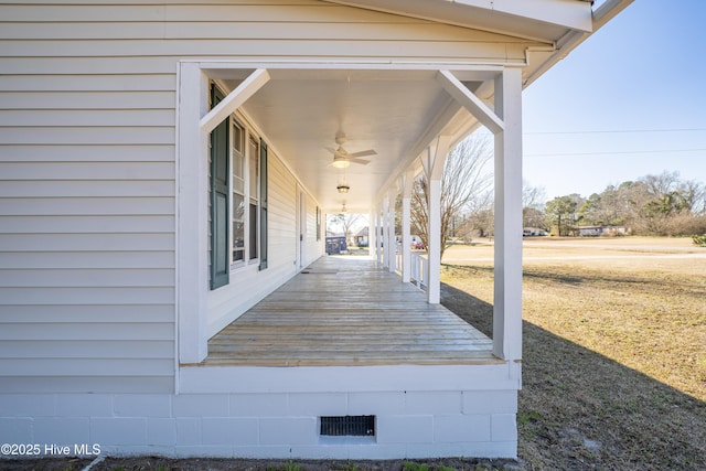 deck with ceiling fan and a porch