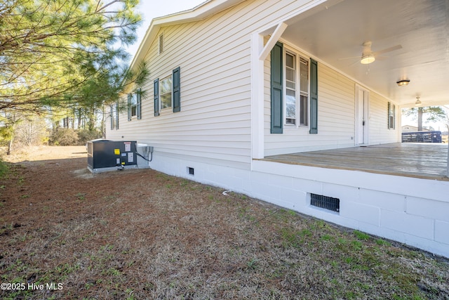 view of home's exterior featuring ceiling fan and central AC unit