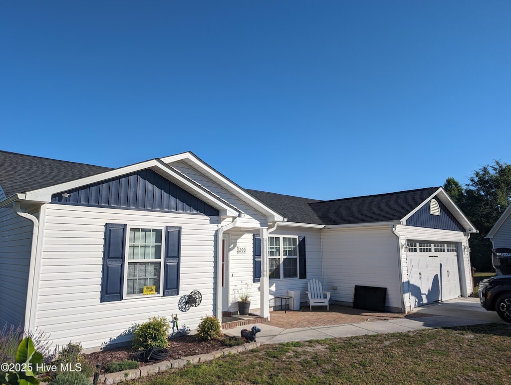 view of front of property with a garage