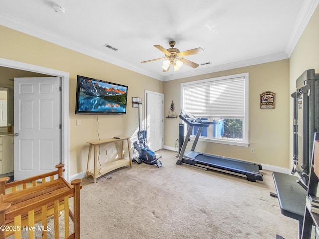 exercise room with ornamental molding, carpet flooring, and ceiling fan