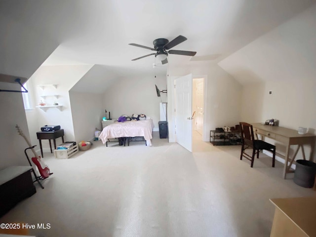 bedroom with lofted ceiling, light colored carpet, and ceiling fan