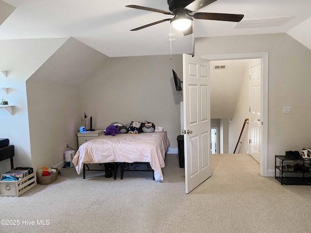 carpeted bedroom featuring lofted ceiling and ceiling fan