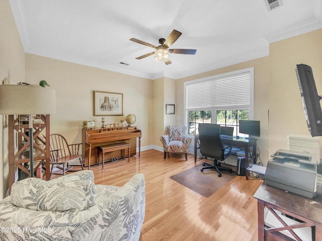 office area featuring ornamental molding, ceiling fan, and light hardwood / wood-style flooring