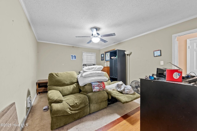 bedroom featuring ceiling fan, ornamental molding, a textured ceiling, and light hardwood / wood-style flooring