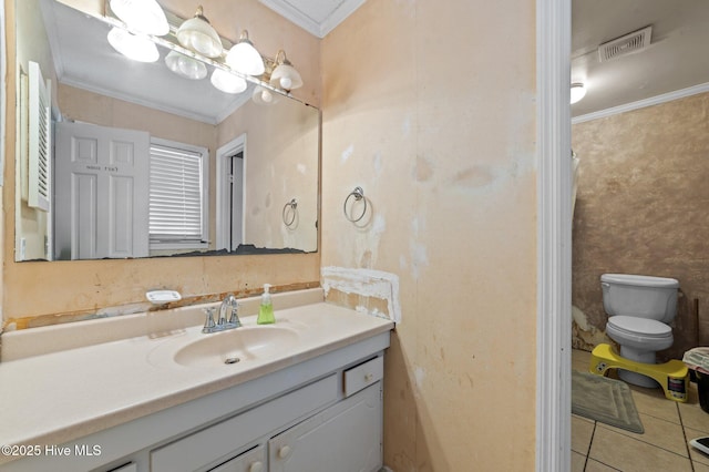 bathroom featuring tile patterned floors, ornamental molding, toilet, and vanity