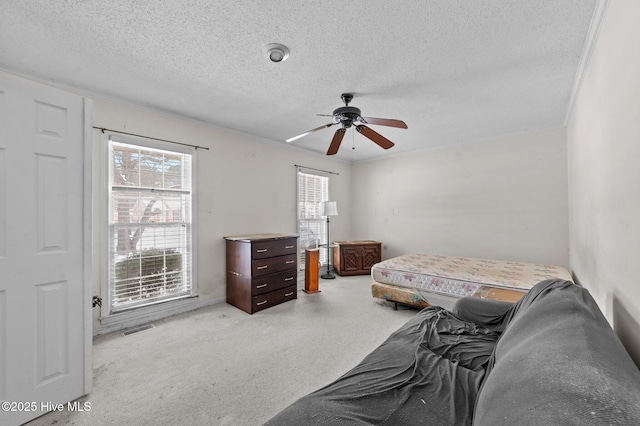 bedroom featuring a textured ceiling and ceiling fan