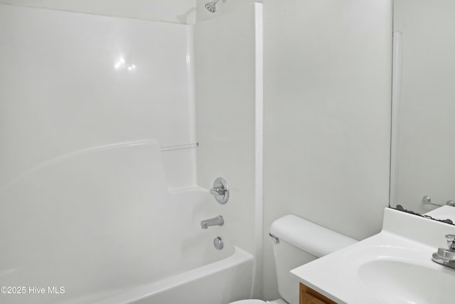 full bathroom with toilet, vanity, and bathing tub / shower combination