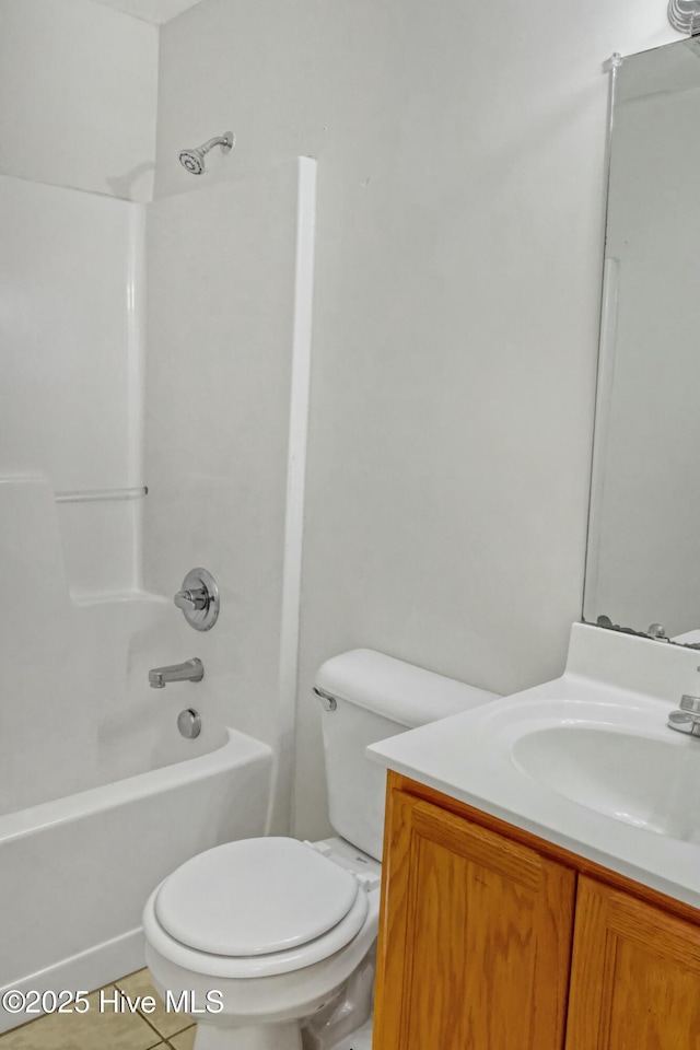 full bathroom featuring toilet, vanity, tub / shower combination, and tile patterned floors