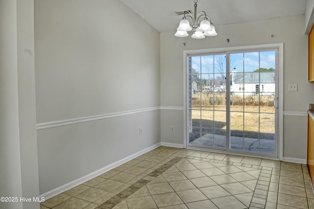 unfurnished dining area featuring a notable chandelier and light tile patterned flooring