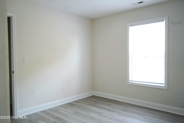 empty room with light hardwood / wood-style floors