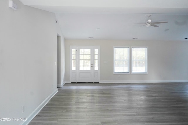 empty room featuring ceiling fan, hardwood / wood-style floors, and lofted ceiling