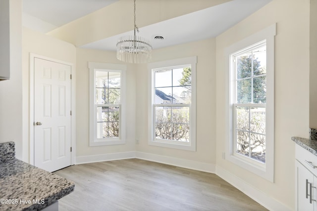 dining room with an inviting chandelier and light hardwood / wood-style floors