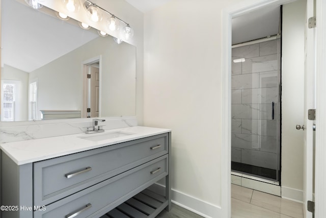 bathroom featuring tile patterned flooring, vanity, and an enclosed shower