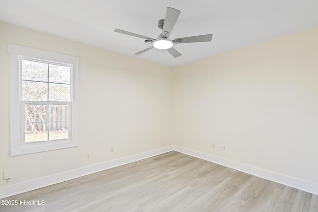 spare room featuring ceiling fan and light hardwood / wood-style flooring